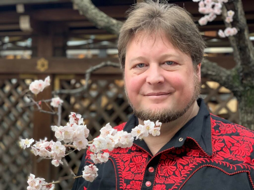 Sig posing neatly next to Ume Blossoms